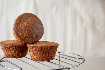Three fresh muffins are on the table