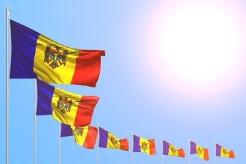 wonderful memorial day flag 3d illustration. - many Moldova flags placed diagonal on blue sky with space for your text