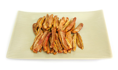 sun dried bananas (honey baked bananas) on plate isolated on white background, Thai preserved food