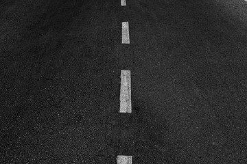 Asphalt road with marking lines white stripes texture Background.