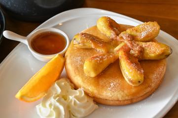 Pancake with caramelized banana on a plate