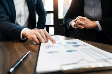 business people and coworker colleagues discussing explanations about week working plan project cooperating in modern coworking office.