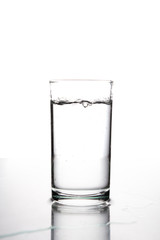 Glass with water on a white background