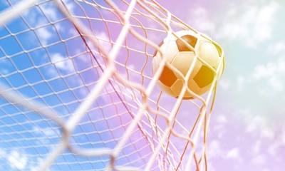 Soccer ball in goal, sport concept