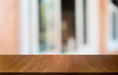 Empty dark wooden table in front of abstract blurred bokeh background of restaurant . can be used for display or montage your products.Mock up for space.