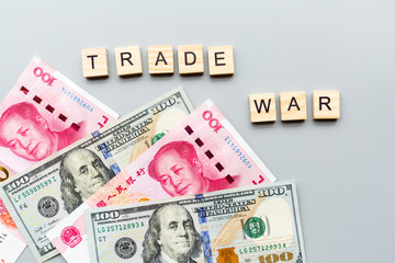 Creative top view flat lay of China and USA flags and cash money, mockup and copy space on gray background in minimal style. Concept of trade war between USA and China