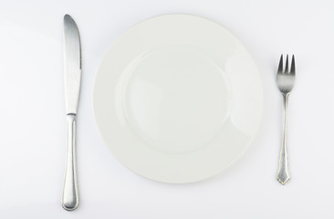 White plate with fork and knife