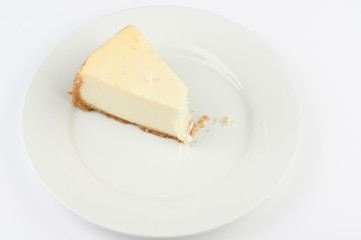 Piece of cheesecake with bite