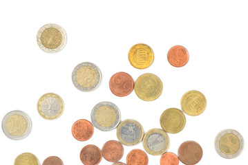 Scattered euro coins isolated on a white background close up