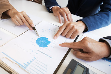 Investment and cooperate concept, business financial inspector analyzing about performance data in office meeting.