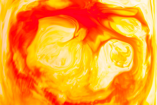 Orange Oil Paint On Water Abstract Background.