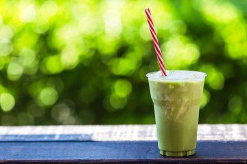 Iced Green tea Placed on a wooden floor