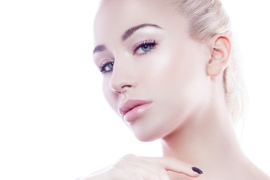 Close-up beauty face of pretty young modern woman. Perfect skin, lips, nude makeup. Isolated. White background. Copy space. Skincare facial treatment concept