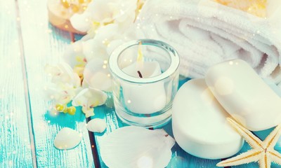 Healthy spa concept with handmade soap bars, oil bottles, towel,candle