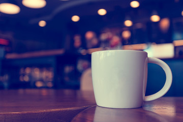 Latte coffee in coffee shop in vintage tone color,view from the top