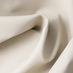 Closeup of light color leather material texture background