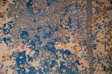 Fototapeta premium old shabby iron surface with rust and remnants of orange paint