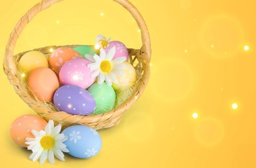 Easter basket filled with colorful eggs on a white background
