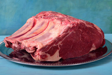 Raw beef meat in a large piece.