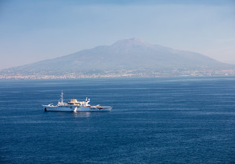 A cruise ship in the Gulf of Naples against the background of Mount Vesuvius. Sorrento, Italy