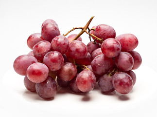 Red Grapes isolated over the white background.