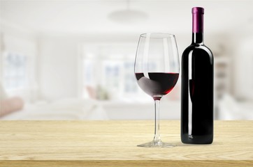 Red wine glass and bootle with shadow on withe background