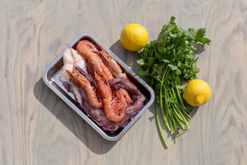 Shrimps and legs of an octopus on a tray