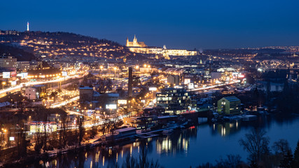 Fototapeta na wymiar Prague cityscape by night with illuminated Prague Castle and Vltava River