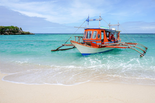 Colorful boat on a sunny beach in the Philippines, filipino banka