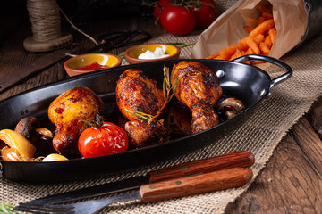 grilled chicken legs in barbecue marinade with sweet potatoes