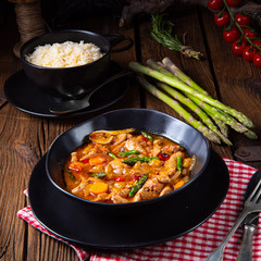colorful turkey fricassee with asparagus and paprika