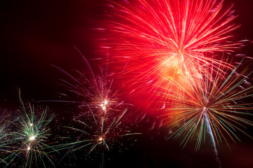 Fototapeta premium Beautiful sparks from fireworks in the sky at night
