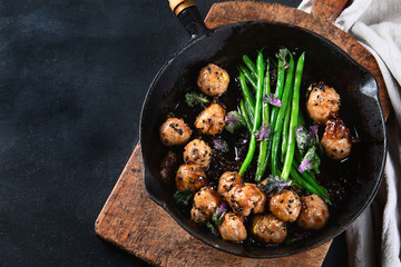 Meatballs, green beans sauce  with sesame and soy sauce