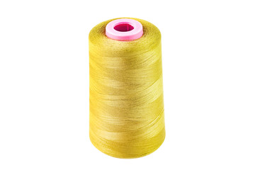 One twisted cylindrical new clean bobbin full of yellow synthetic threads isolated on white background
