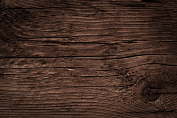 Obraz premium Texture of dark brown old rough wood. Abstract background for design. Vintage retro