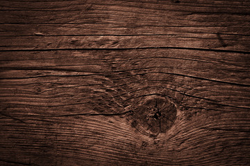 Naklejka premium Texture of dark brown old rough wood. Abstract background for design. Vintage retro
