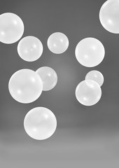 White balloons on dark grey background