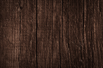 Texture of dark brown old rough wood. Abstract background for design. Vintage retro