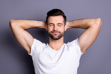 Close-up portrait of his he nice-looking attractive cheery bearded guy having rest chill out serenity isolated over gray pastel violet purple background