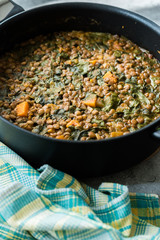 Homemade Lentil Stew / Soup with Chard and Sweet Potatoes in Pot Pan