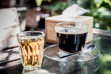 One cup of Americano coffee, ready to drink on the table