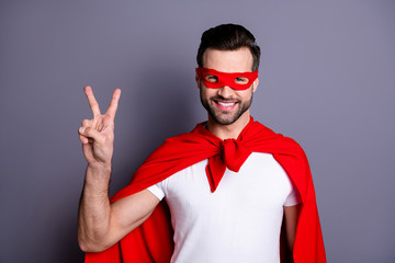 Portrait of his he nice-looking attractive cheerful cheery bearded guy showing v-sign macho...