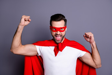 Portrait of his he nice-looking attractive cheerful cheery positive bearded guy celebrating triumph...