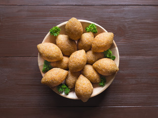 Traditional Arabic kibbeh with lamb and pine nuts.