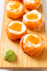 fresh salmon sushi roll with mayonnaise and shrimp egg