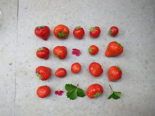 Fresh strawberries on the cement table