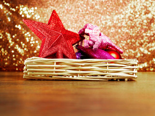 Christmas season decorations in a wooden box, Glittering bokeh background.