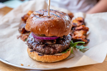 Grilled hamburger with lettuce and onion