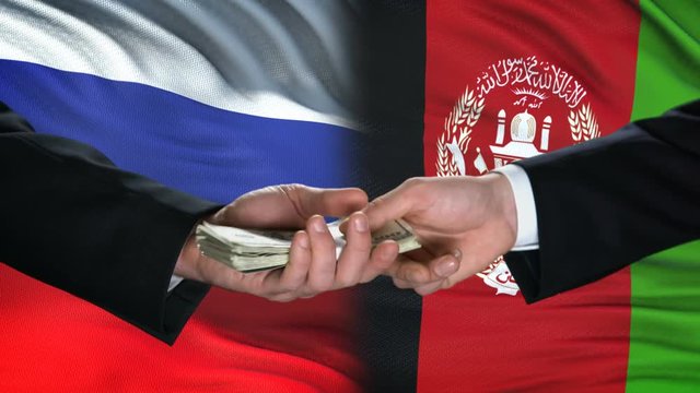 Russia and Afghanistan officials exchanging tank for money, flag background