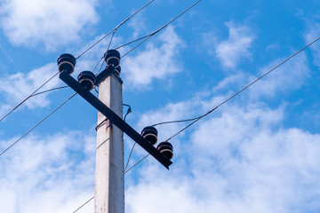 Obraz premium A pole with electrical wires under tension.